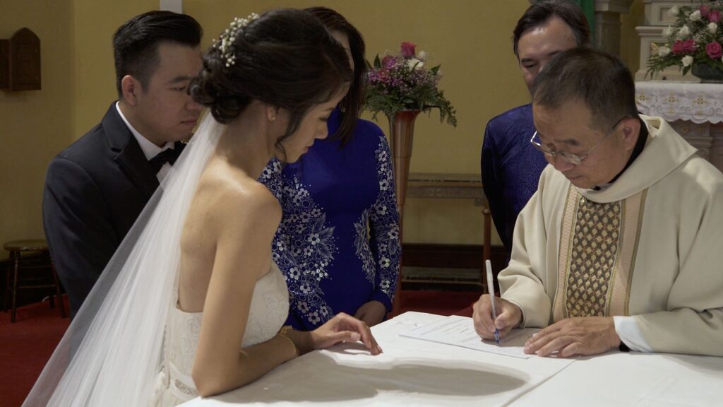 Vietnamese Weding Tea Ceremony Bride and Groom sign marriage license