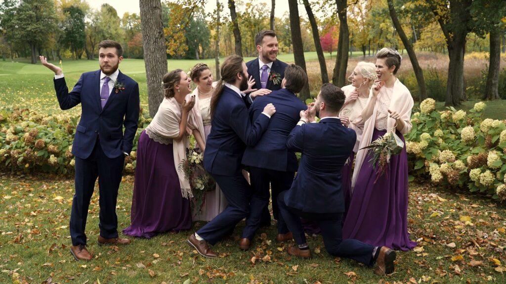 Bearpath Wedding Groom poses with wedding party outside