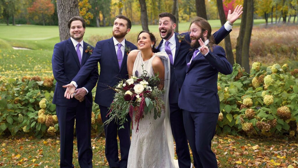 Bearpath Wedding Bride poses with Groomsmen outside