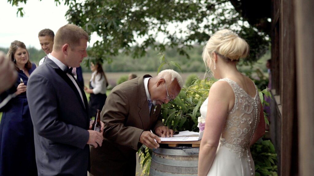 The Kelley Farm Wedding Bride and Groom Sign Marriage License