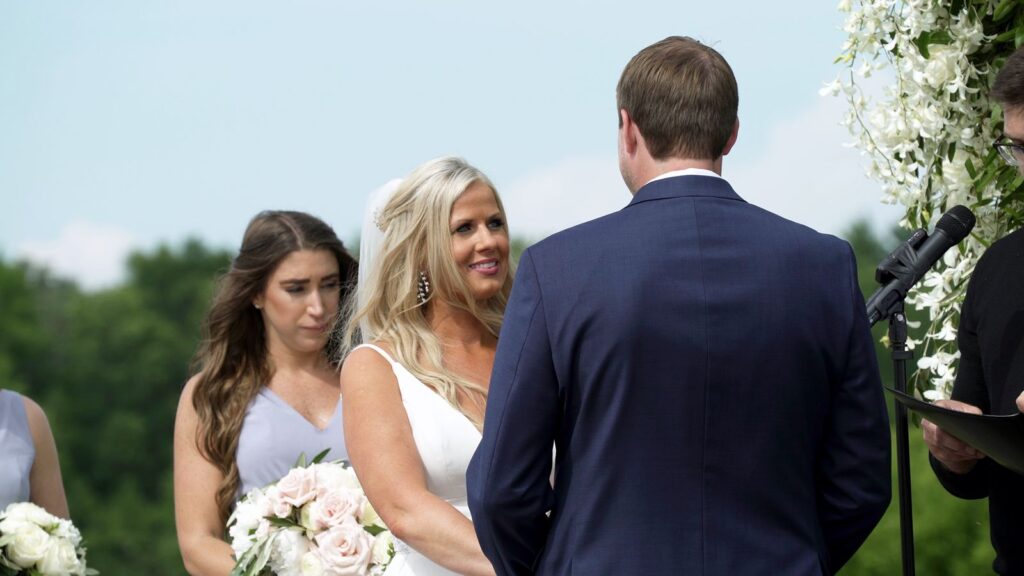 Bride and groom exchange vows at Bavaria Downs Wedding Videography