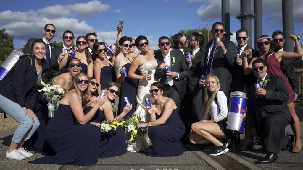 Minneapolis Radisson blu Wedding Wedding Party shares a fun moment and photo op with the Redbull Crew
