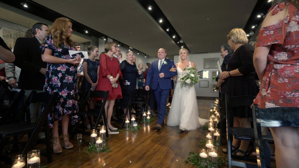 Minneapolis Five Event Center Wedding Bride Comes Down The Aisle During Ceremony