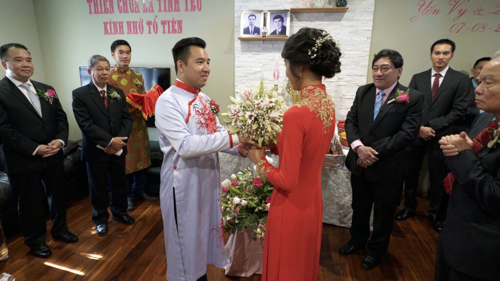 Vietnamese Weding Tea Ceremony Bride and Groom Exchange Flowers
