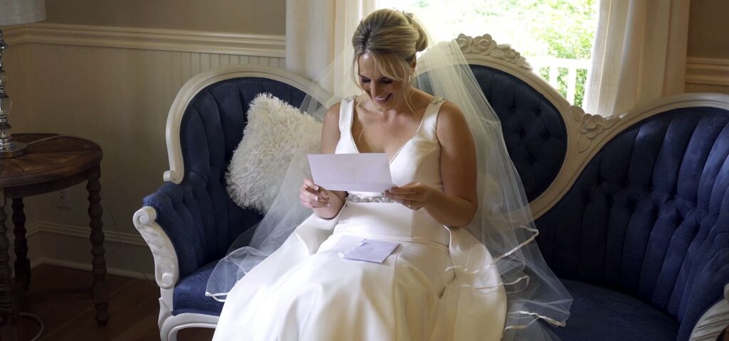 The Kelley Farm Wedding Bride reads letter from Groom
