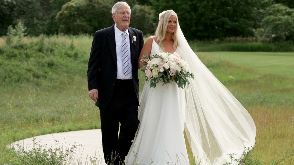 Bavaria Downs Wedding bride walks down the aisle with Father.
