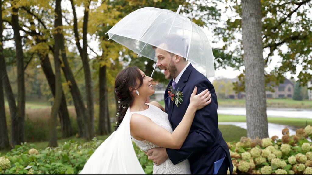Bride and Groom under an umbrella during October Ice storm at Bearpath Golf and Country Club Wedding