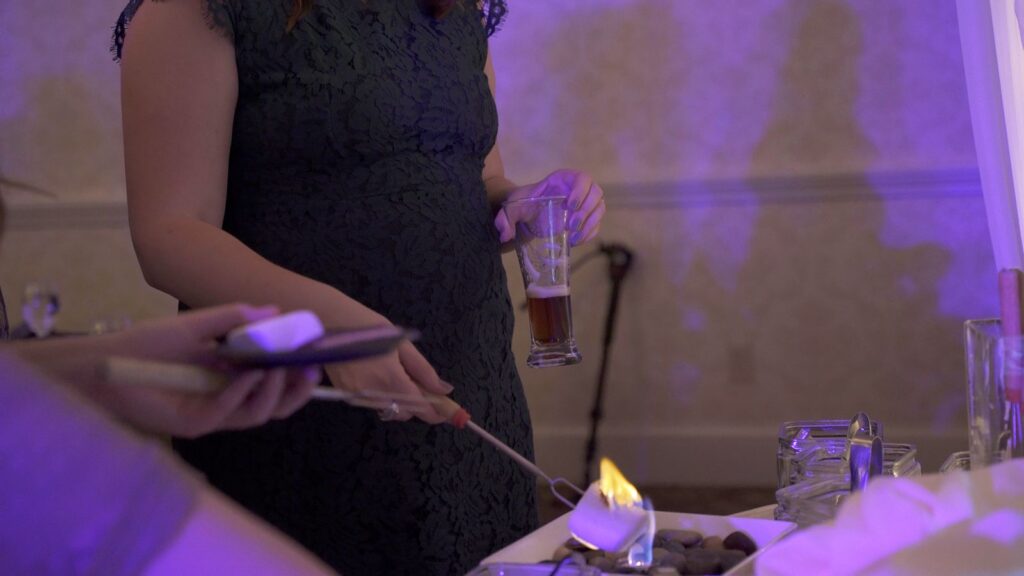 Wedding guests make smores at Bearpath Golf and Country Club Wedding