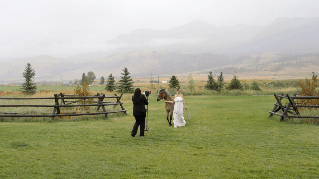 why wedding videography is essential Limited Edition Productions Videographer with Bride and Horse at Copper Rose Ranch in Livingston, MT