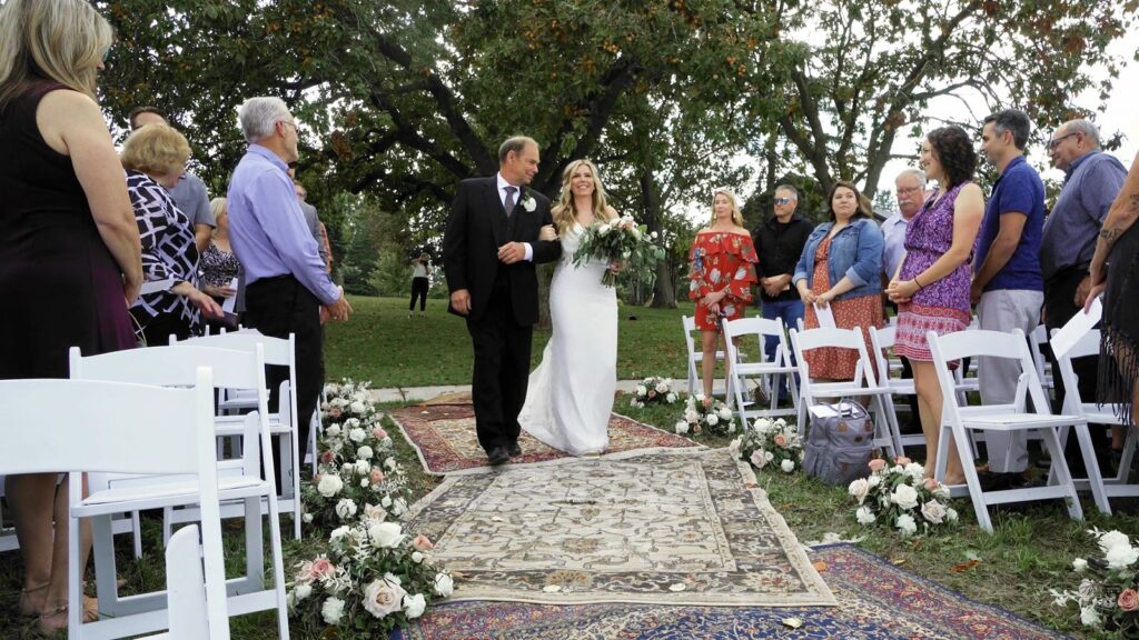 Bride and Father walk down the aisle at Carpenter Nature Center Wedding